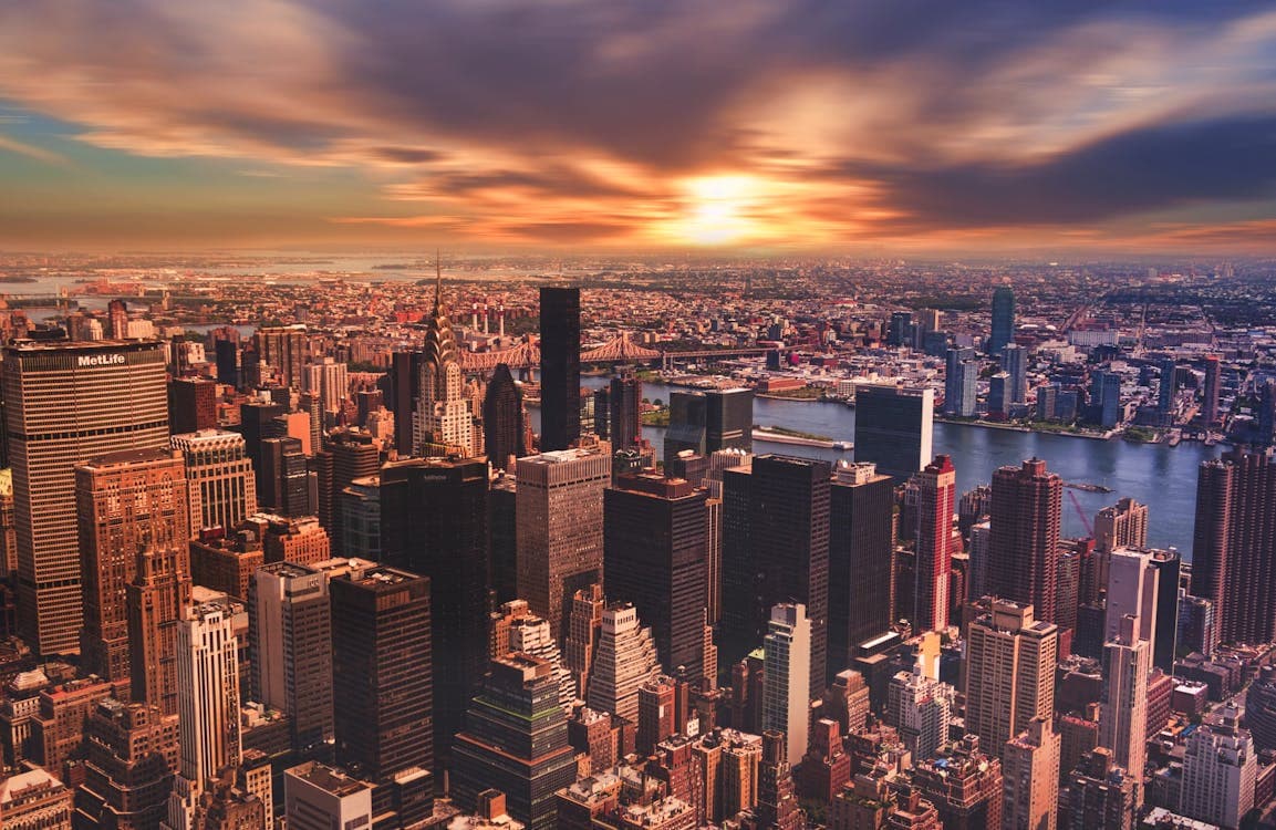Golden sunrise over city skyline